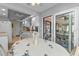 Kitchen dining area with table and chairs, and view into screened porch at 638 Andros Ct, Punta Gorda, FL 33950