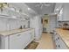 Bright kitchen with white cabinets, granite counters, and ample shelving at 638 Andros Ct, Punta Gorda, FL 33950