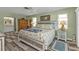 Main bedroom with king-size bed and en-suite bathroom access at 638 Andros Ct, Punta Gorda, FL 33950