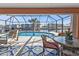 Inviting pool area with patio furniture and water views at 638 Andros Ct, Punta Gorda, FL 33950