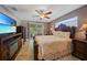 Main bedroom with a king-size bed and ensuite bathroom at 7083 Mifflin St, Englewood, FL 34224