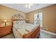 Bright bedroom with a wooden bed frame and ample natural light at 7083 Mifflin St, Englewood, FL 34224