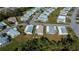 Aerial view showcasing a neighborhood of mobile homes at 805 Manchester Ct, Englewood, FL 34223