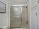 Bathroom with a sliding glass shower door at 805 Manchester Ct, Englewood, FL 34223