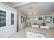 Bright kitchen features granite countertops and white cabinets at 805 Manchester Ct, Englewood, FL 34223