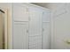 Laundry area with ample storage cabinets at 805 Manchester Ct, Englewood, FL 34223