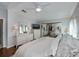 Bright bedroom with large closet and white furniture at 805 Manchester Ct, Englewood, FL 34223