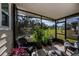 Screened porch overlooking backyard; great for relaxing at 805 Manchester Ct, Englewood, FL 34223