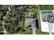 Aerial view showcasing home's location, landscaping, and neighborhood at 8117 Thruso Rd, Port Charlotte, FL 33981