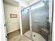 Walk-in shower with bench seat and grab bars at 8117 Thruso Rd, Port Charlotte, FL 33981