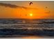 Stunning sunset over ocean waves at 8117 Thruso Rd, Port Charlotte, FL 33981