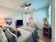 Bright bedroom with a queen bed and access to another room at 8117 Thruso Rd, Port Charlotte, FL 33981