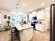 Modern kitchen with white cabinets and granite island at 8117 Thruso Rd, Port Charlotte, FL 33981