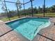 Inviting screened-in pool with brick pavers at 8117 Thruso Rd, Port Charlotte, FL 33981