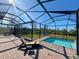 Relaxing screened pool and patio area at 8117 Thruso Rd, Port Charlotte, FL 33981