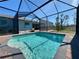 Inviting screened pool with paved patio at 8117 Thruso Rd, Port Charlotte, FL 33981