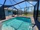 Inviting screened pool with paved patio at 8117 Thruso Rd, Port Charlotte, FL 33981