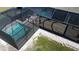 Aerial view of a screened pool and patio area at 8117 Thruso Rd, Port Charlotte, FL 33981