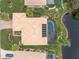 Bird's eye view of property featuring tile roof, solar panels and screened pool at 8242 Lakeside Dr, Englewood, FL 34224