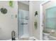 Bathroom showcasing a glass-enclosed shower and a toilet in a separated water closet at 8242 Lakeside Dr, Englewood, FL 34224