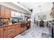 Functional kitchen with a copper sink, granite countertops, and an open layout to other rooms at 8242 Lakeside Dr, Englewood, FL 34224