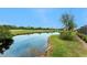 Scenic water view showcasing lush greenery and serene blue skies at 8242 Lakeside Dr, Englewood, FL 34224