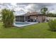 Home with a screened pool and patio at 939 Silver Springs Nw Ter, Port Charlotte, FL 33948