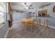 Dining room with wooden table and chairs, and access to kitchen at 939 Silver Springs Nw Ter, Port Charlotte, FL 33948