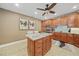 Well-equipped kitchen with granite countertops and wood cabinets at 95 N Marion Ct # 233, Punta Gorda, FL 33950