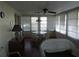 Sunroom with wicker furniture and a view of the garden at 120 Rodgers Ne Ave, Port Charlotte, FL 33952