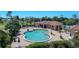 Resort-style pool with lounge chairs and a pool house at 10214 Windsong Rd, Punta Gorda, FL 33955