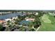 Aerial view of community tennis courts, pool, and golf course at 10214 Windsong Rd, Punta Gorda, FL 33955
