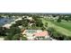 Community pool, tennis courts, and nearby homes at 10214 Windsong Rd, Punta Gorda, FL 33955