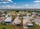 Aerial view of a single-Gathering home with a screened lanai at 10214 Windsong Rd, Punta Gorda, FL 33955