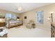Spacious Primary bedroom with king-size bed and sitting area at 10214 Windsong Rd, Punta Gorda, FL 33955
