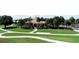 Community clubhouse with a red tile roof at 10214 Windsong Rd, Punta Gorda, FL 33955