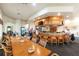 Relaxing clubhouse bar with seating and large dining tables at 10214 Windsong Rd, Punta Gorda, FL 33955