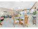 Dining area with four chairs and view of living room at 10214 Windsong Rd, Punta Gorda, FL 33955