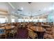 Community clubhouse dining room with tables, chairs, and chandeliers at 10214 Windsong Rd, Punta Gorda, FL 33955