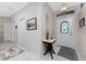 Bright entryway with tile flooring and stained glass at 10214 Windsong Rd, Punta Gorda, FL 33955