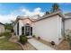 Inviting front exterior with a walkway and landscaping at 10214 Windsong Rd, Punta Gorda, FL 33955