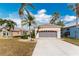 Two-car garage and well maintained front yard at 10214 Windsong Rd, Punta Gorda, FL 33955