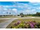 Peaceful golf course with golf carts and beautiful landscaping at 10214 Windsong Rd, Punta Gorda, FL 33955