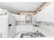 White kitchen with ample counter space and appliances at 10214 Windsong Rd, Punta Gorda, FL 33955
