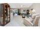 Spacious living room with light teal sofa and recliner at 10214 Windsong Rd, Punta Gorda, FL 33955