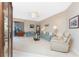Spacious living room with light teal sofa and recliner at 10214 Windsong Rd, Punta Gorda, FL 33955
