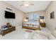Spacious Primary bedroom with king-size bed and large TV at 10214 Windsong Rd, Punta Gorda, FL 33955