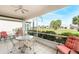 Relaxing screened porch with seating and ceiling fan at 10214 Windsong Rd, Punta Gorda, FL 33955