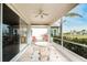 Spacious screened porch with glass doors and outdoor seating at 10214 Windsong Rd, Punta Gorda, FL 33955