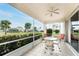 This screened porch offers a relaxing outdoor space with seating at 10214 Windsong Rd, Punta Gorda, FL 33955